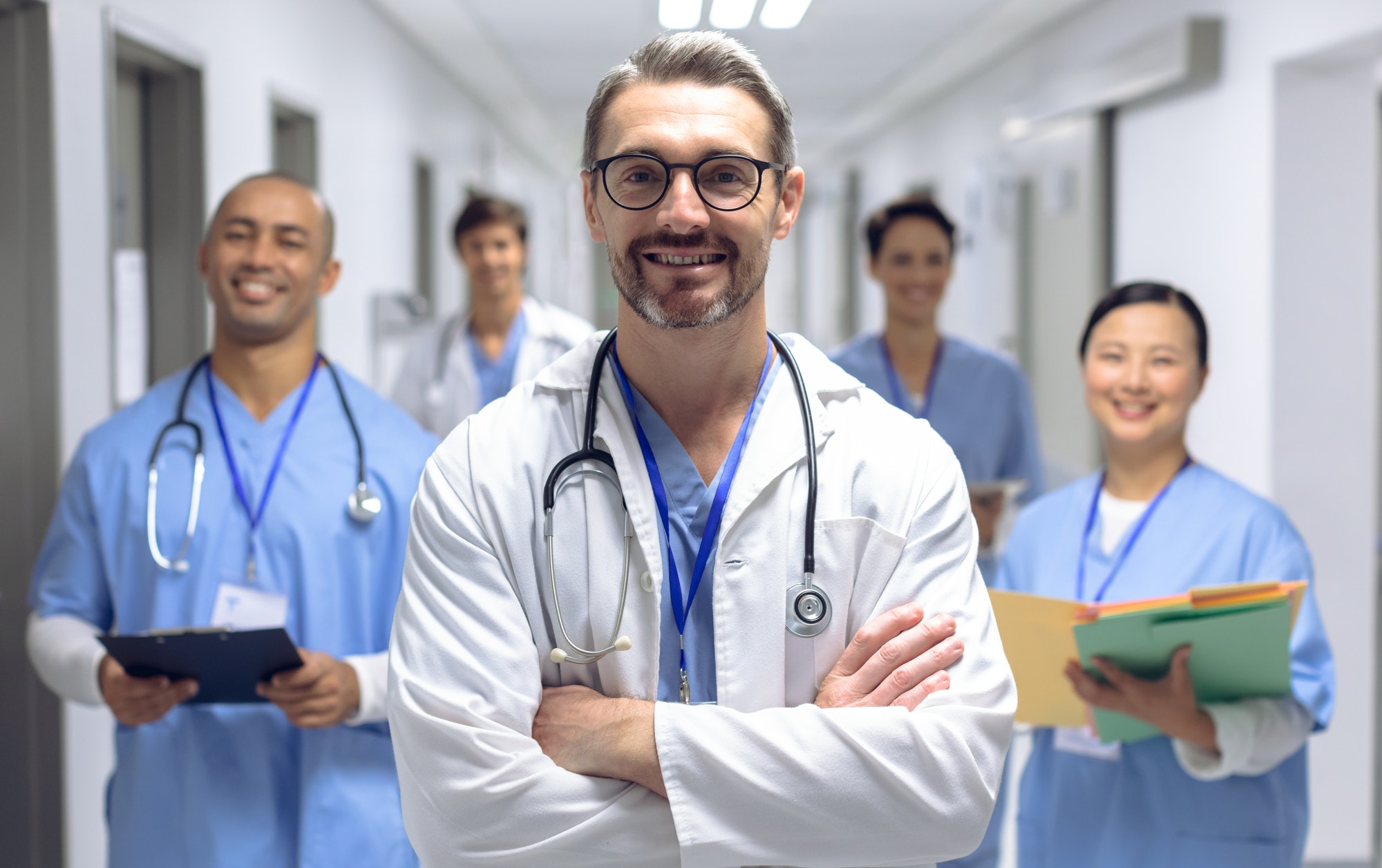diverse-medical-team-of-doctors-looking-at-camera-while-holding-clipboard-and-medical-files.jpg diverse-medical-team-of-doctors-looking-at-camera-while-holding-clipboard-and-medical-files.jpg